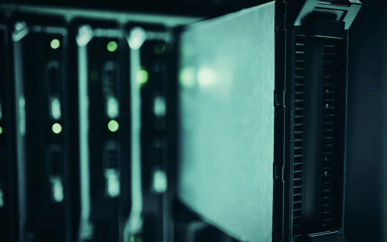 Data center aisle with rows of illuminated servers
